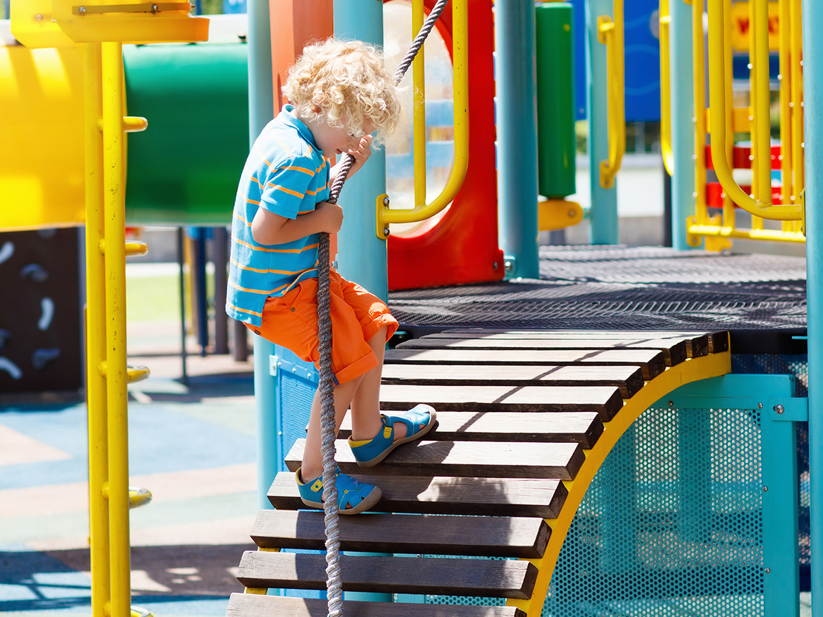 Toddler playing on playground