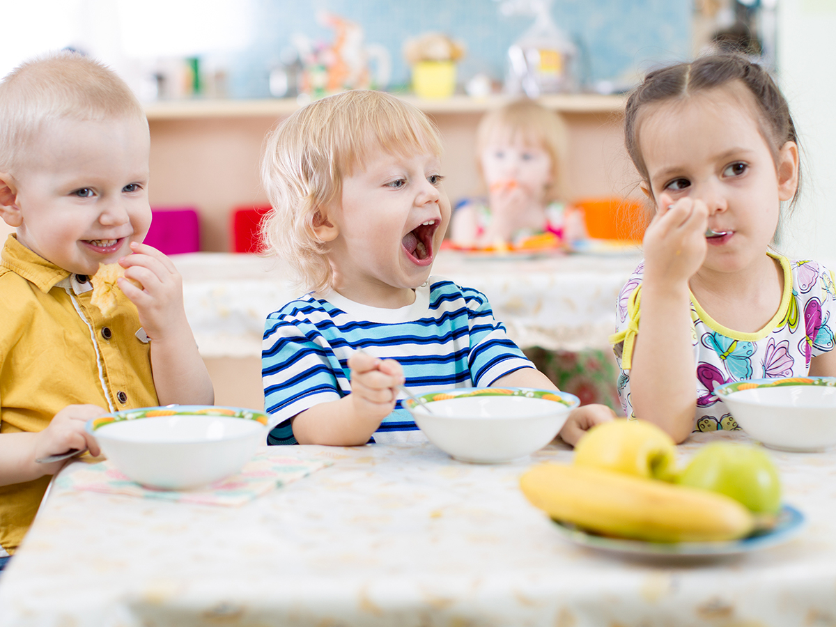 Toddlers enjoying a snack during class