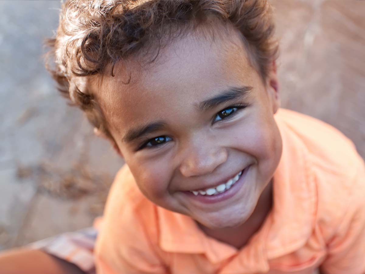 A young boy smiling at the camera