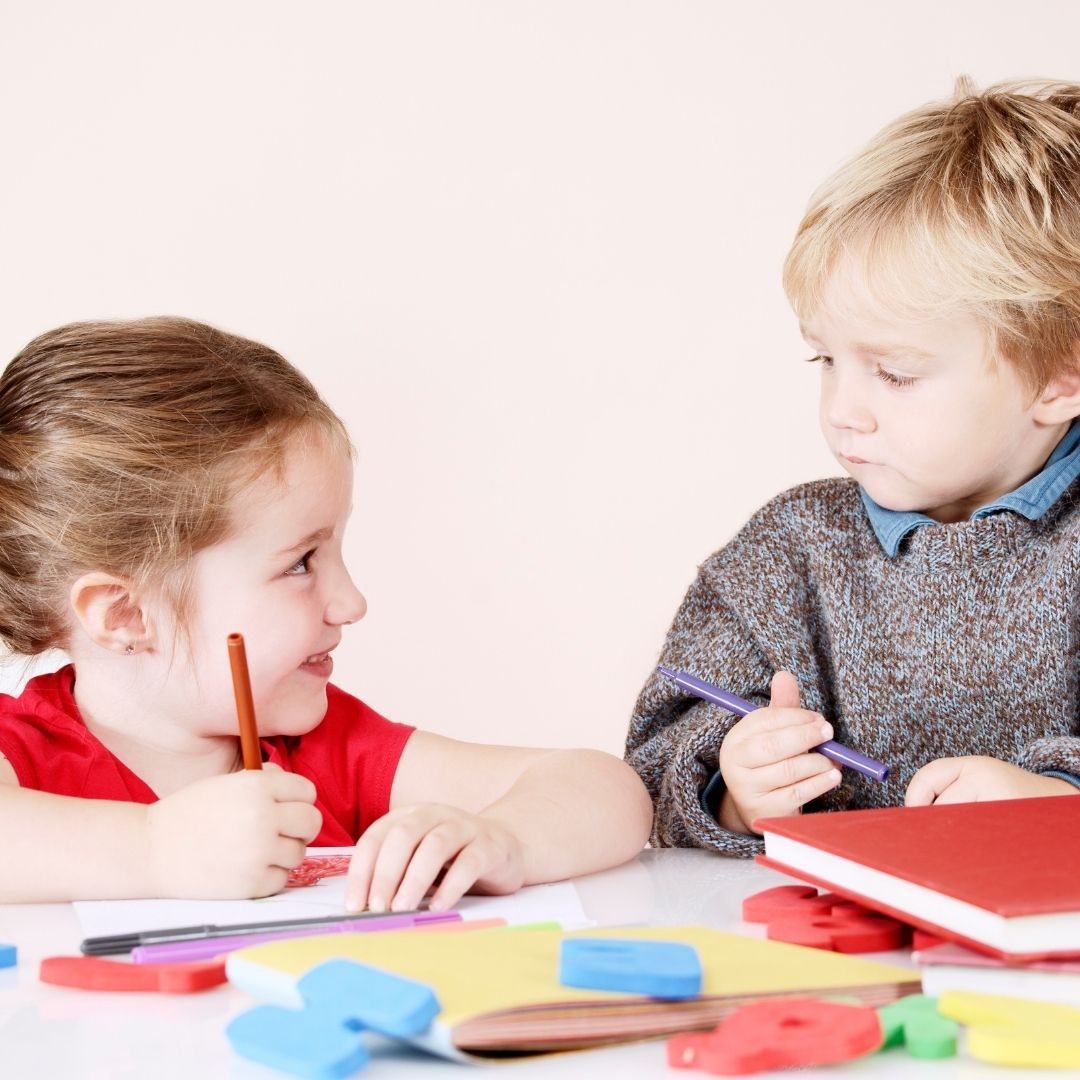 children writing letters together