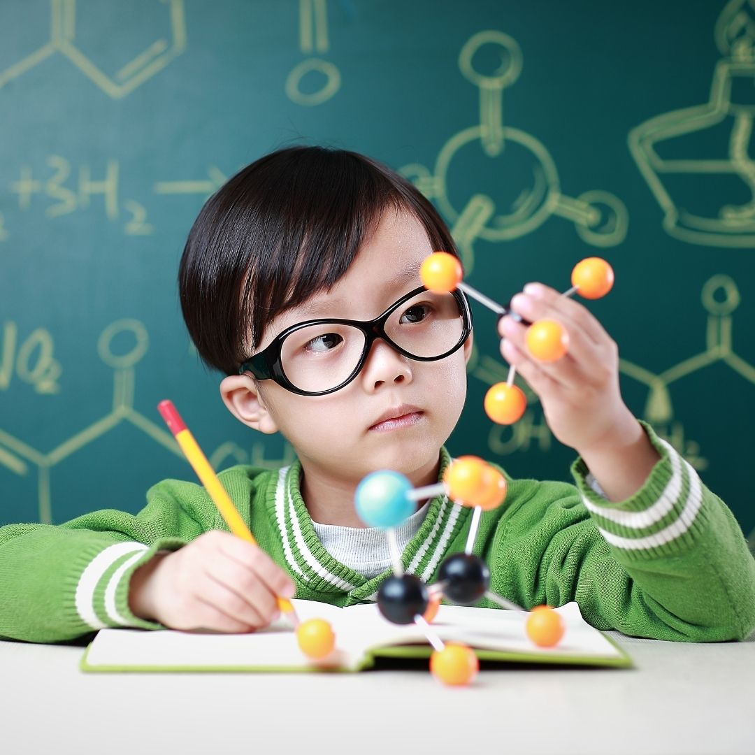 child learning about molecules