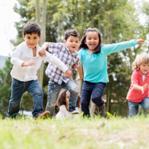 kids running through a field