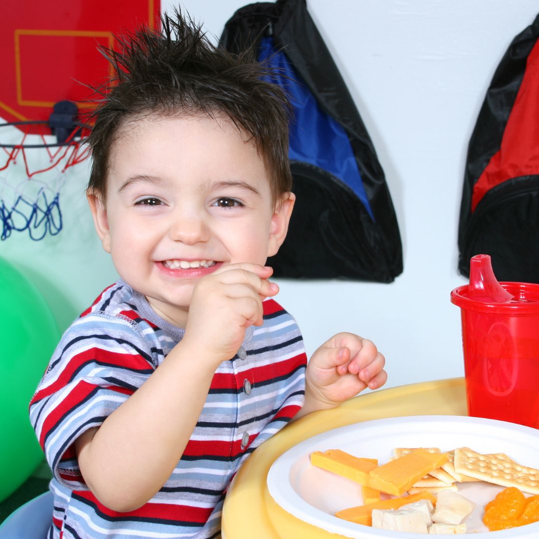 preschooler eating cheese and crackers