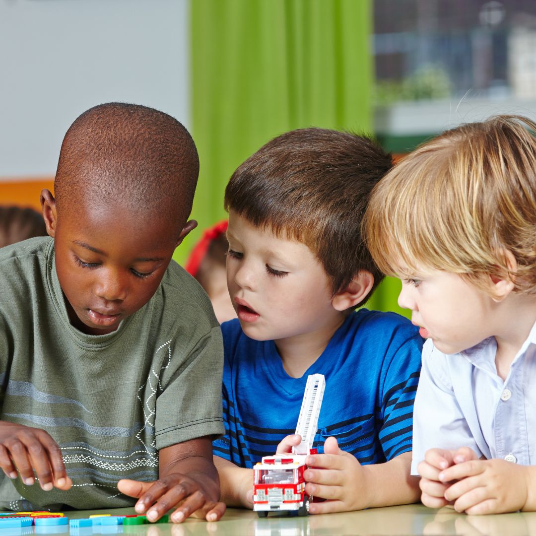3 children playing together at daycare