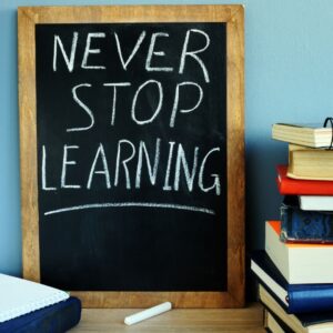 chalkboard sign reading Never Stop Learning
