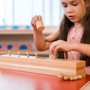 child playing with an educational toy