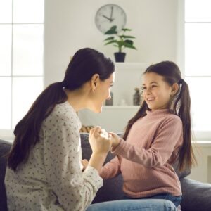 mother talking to daughter