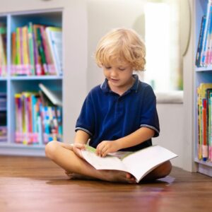 child looking at a book