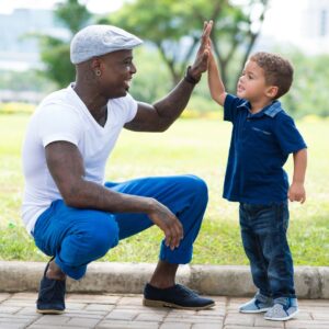 child giving father a high five