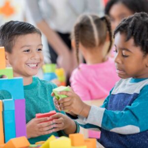 two boys playing with blocks