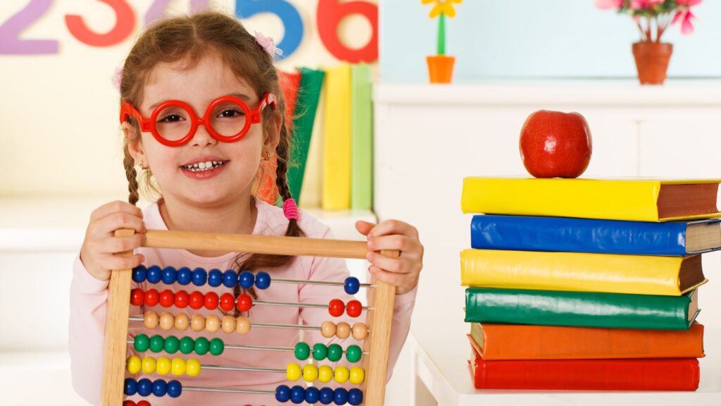little girl holding up an abacus