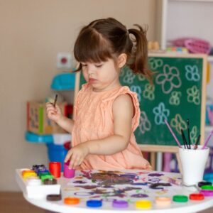 Young girl painting. 