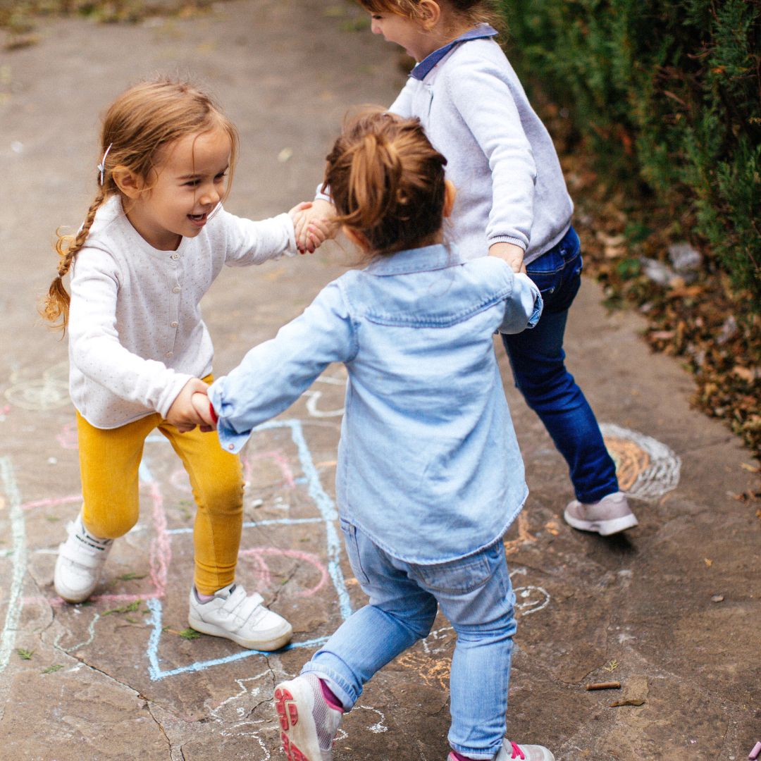 kids skipping around in a circle