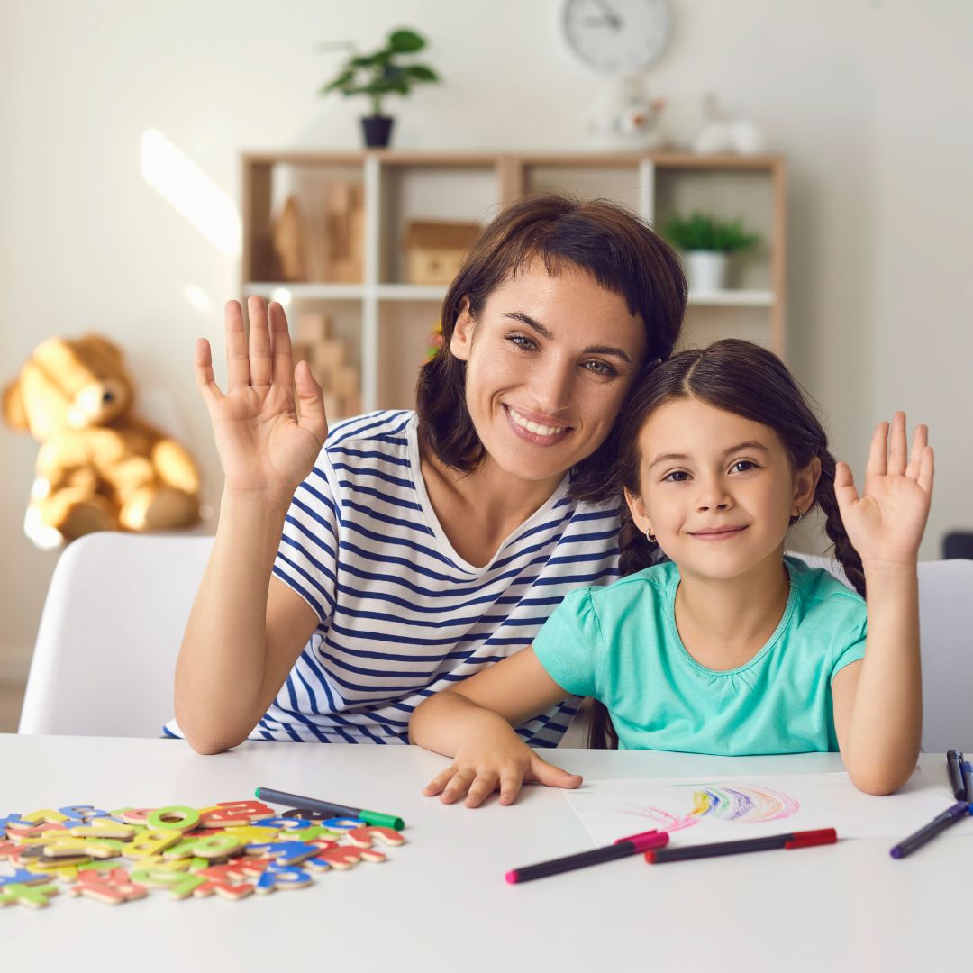 teacher and student waving