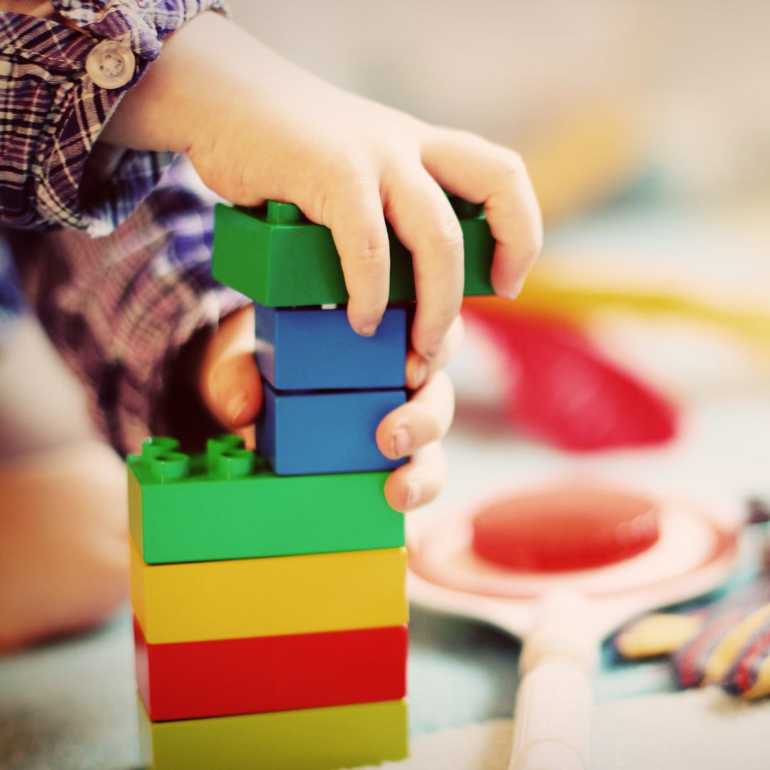 child using building blocks